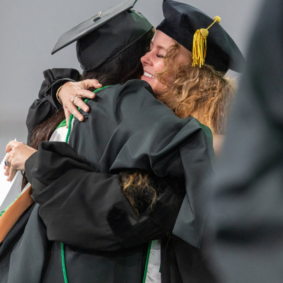 Foundation Founder Audrey McLoghlin hugging a Babson graduate student.